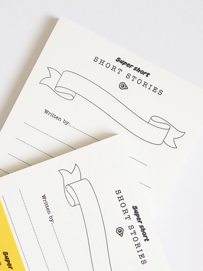 Odd Goose Super Short Stories creative writing notepad seen top down and cropped to highlight title banner