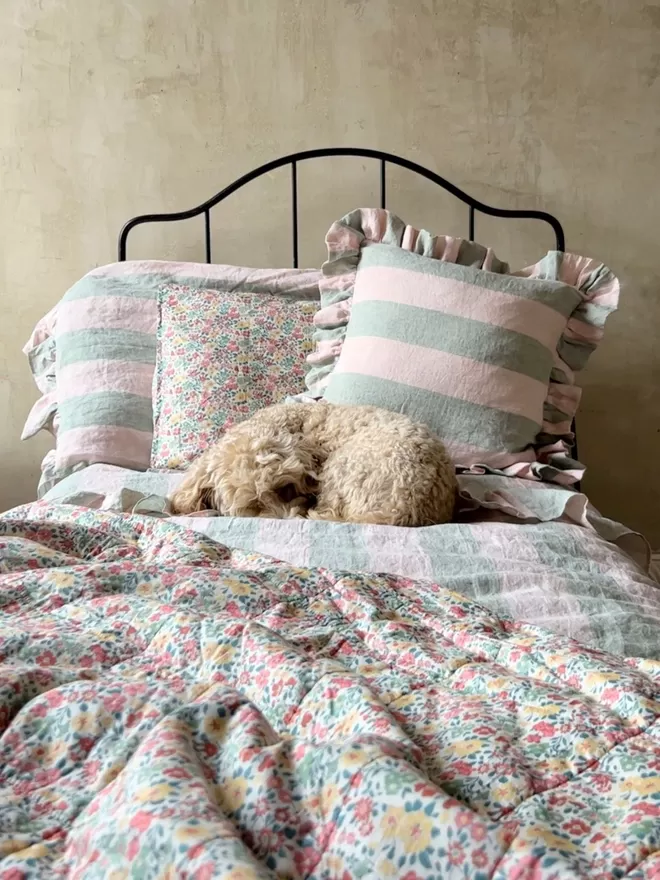 Ruffle Cushion in 'Gelato' displayed on a bed