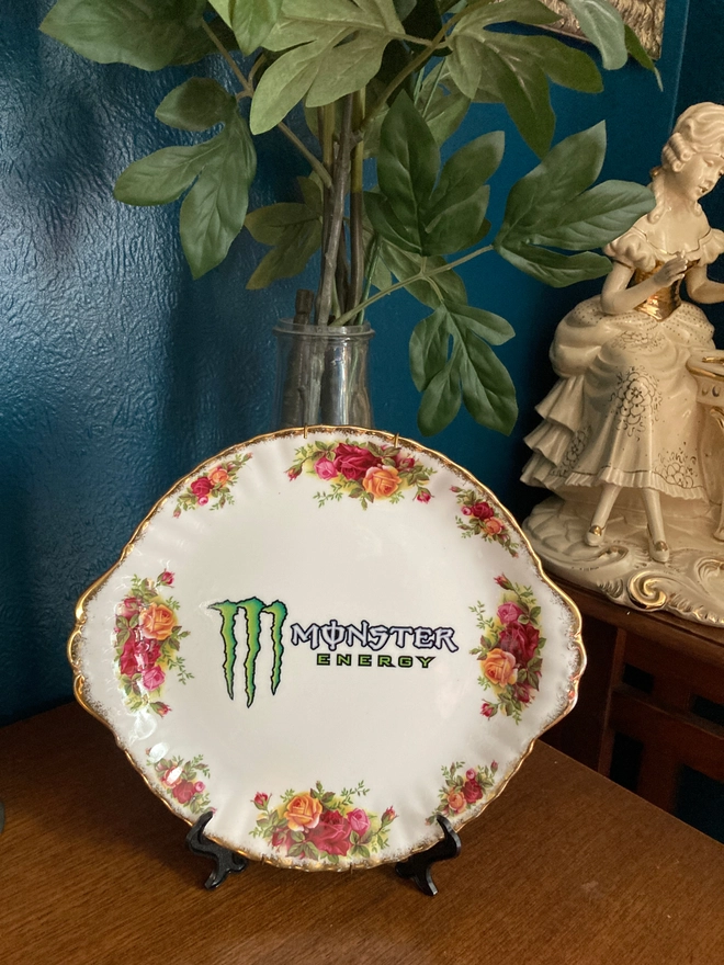 Vintage floral plate featuring the 'Monster Energy' logo