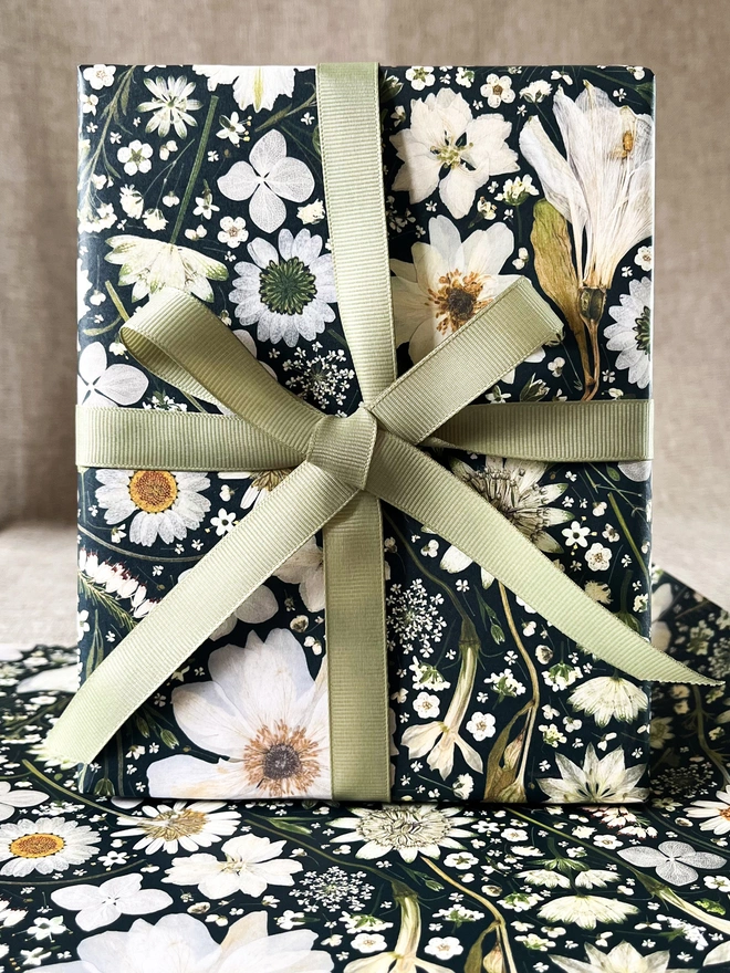 Luxury gift wrap paper sheets created from pressed white flowers, including Nigella, Daisy, Astrantia, Queen Anne's Lace, Hydrangea, Cow Parsley and Heather.