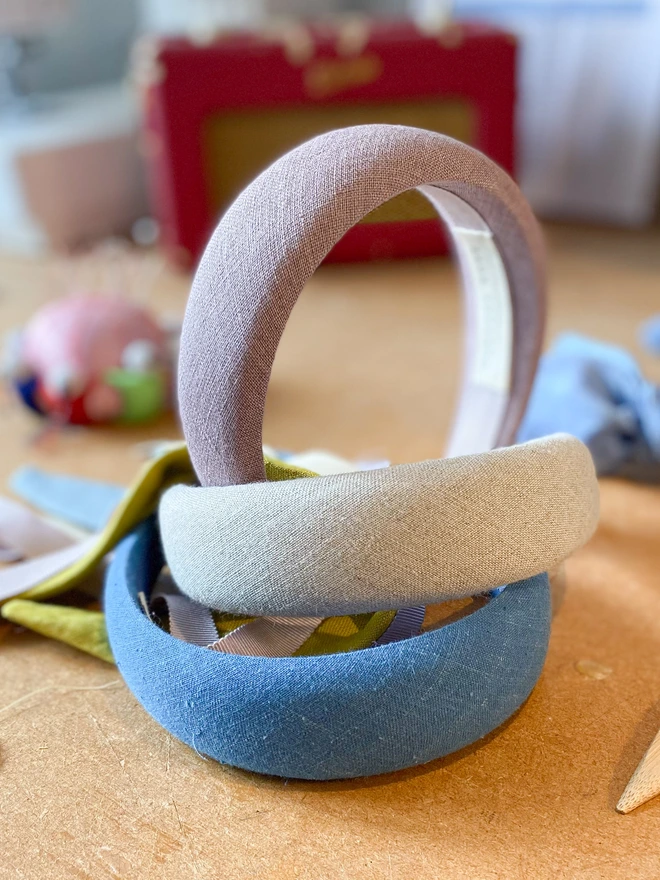 Lilac Linen Headband on our sewing table with others being made