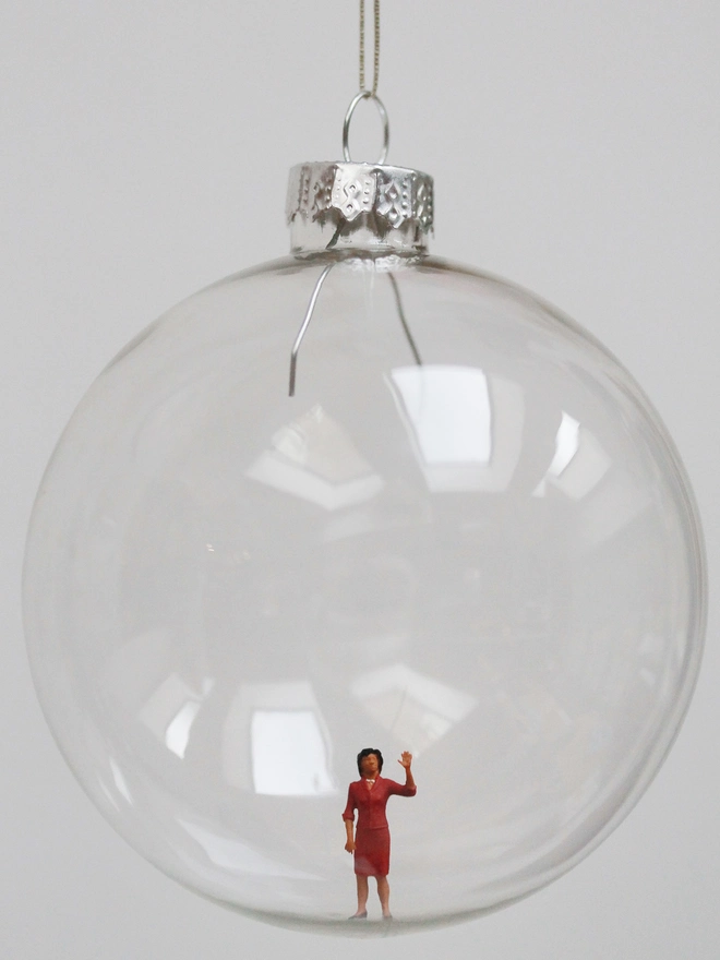 Miniature figure of Michelle Obama in a glass hanging christmas bauble 