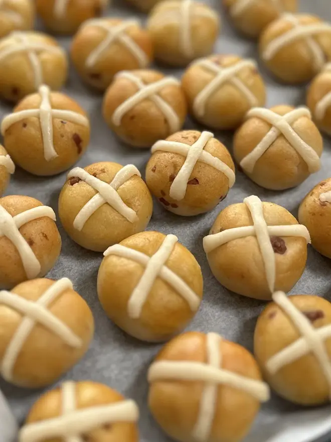 Marzipan Hot Cross Buns (Box Of 6 Or 9), a group of marzipan hot cross buns displayed on a metal tray. 