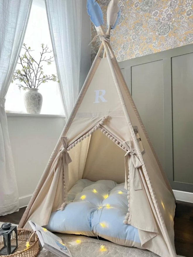 Personalised Natural & Blue Kids’ Teepee. A canvas teepee with blue accents.
