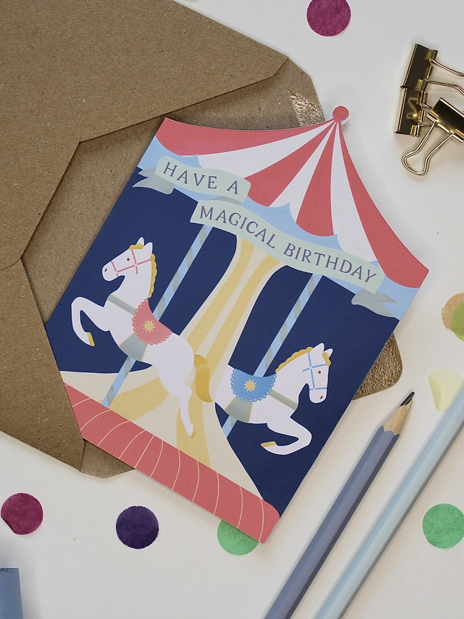 Carousel Circus Birthday card with two horses on a merry go round