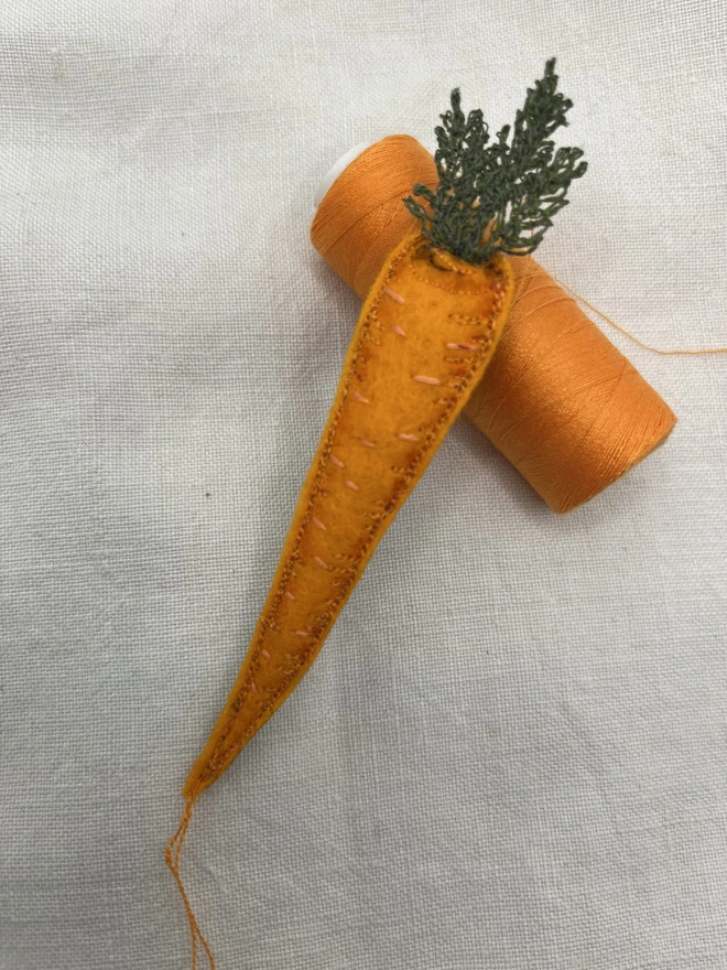 brooch with cotton reel