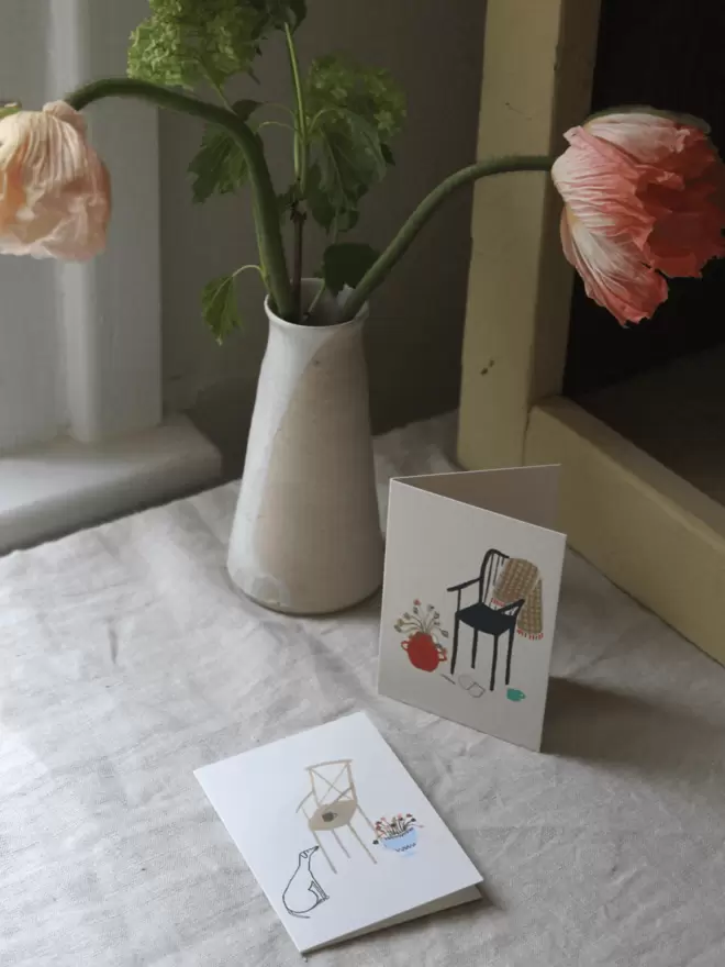 greeting card with a dog and flowers on it. 