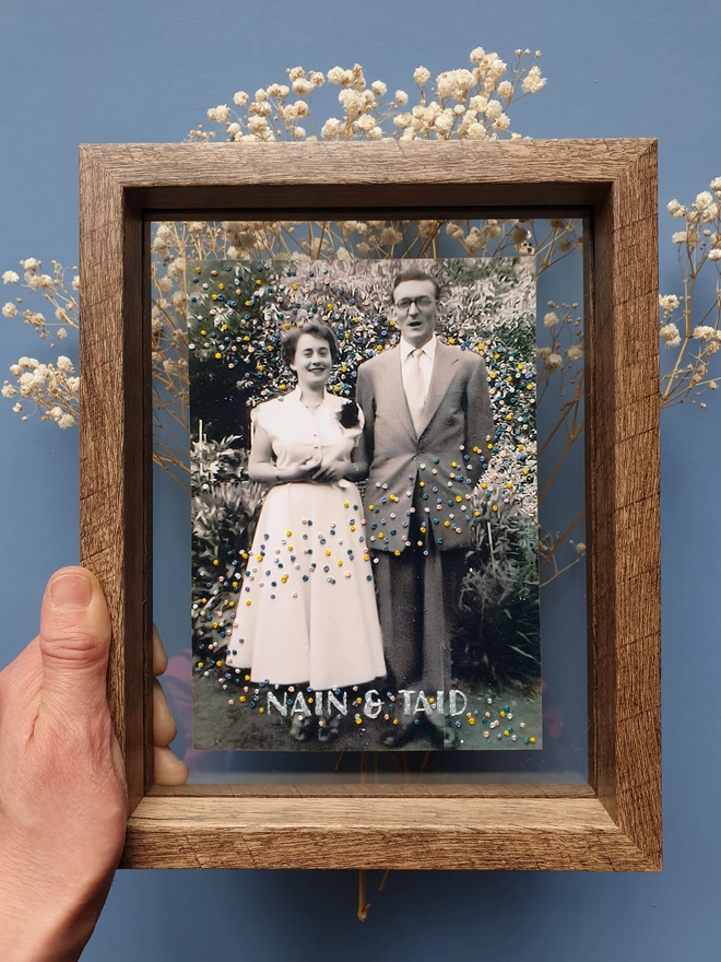  Wedding photo with hand embroidered confetti and name held in double glass frame