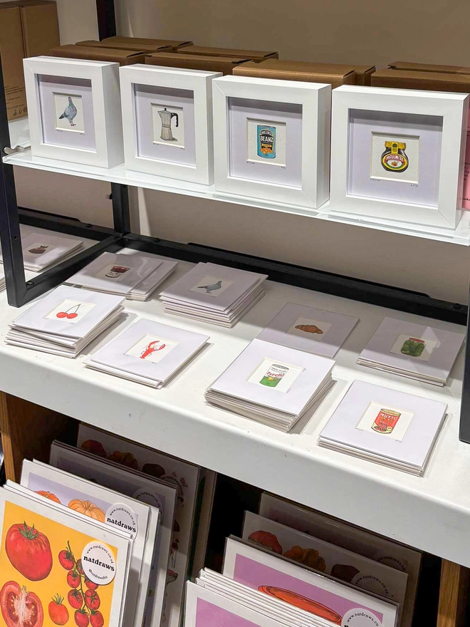 A collection of framed and unframed tiny prints, featuring mini print illustrations of favourite foods like Marmite, Heinz Benz, Perello, coffee or Mutti