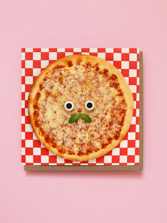 A happy pizza with a moustache 