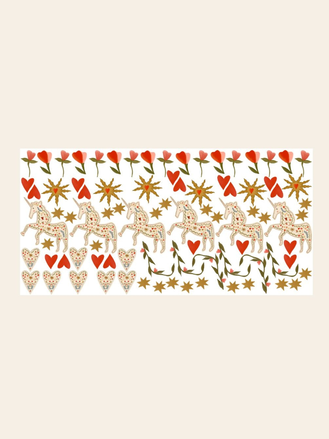 unicorn garden wall stickers. a sheet of unicorn and flower stickers on a white sheet.
