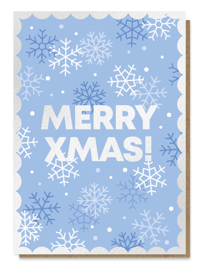 Greeting card with illustrations of blue and silver snowflakes. The card has silver edges in a scalloped pattern with the words "Merry Xmas!" 