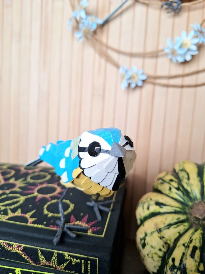 Eurasian blue tit bird standing sculpture