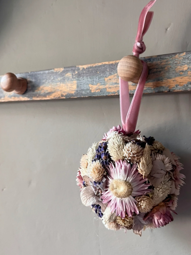 Pastel Dried Flower Bauble. A bauble made of dried pastel flowers.