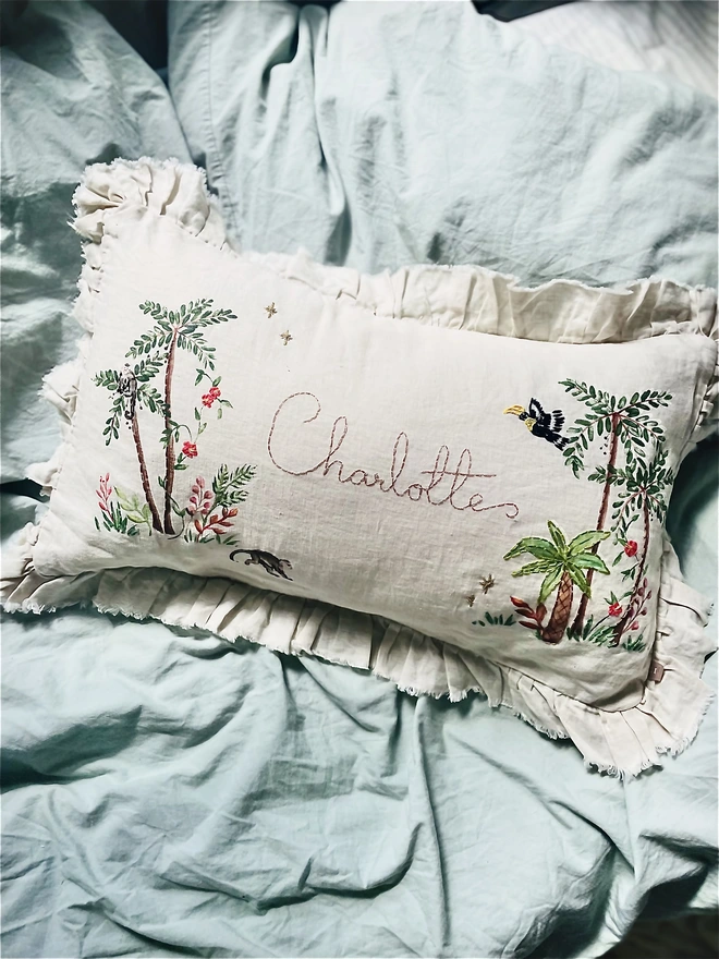 Hand Embroidered Tropical Jungle cushion on natural linen with personalised name 