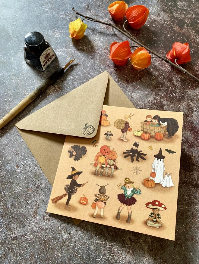 halloween card featuring an illustration of children dressed in fancy dress drawn in a vintage style children's boo illustration