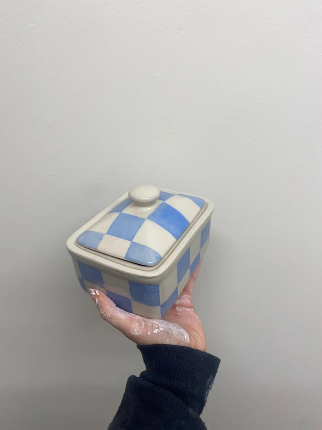  Checkered Blue & Cream Handmade Ceramic Butter Dish, a blue patterned butter dish held against a white backdrop. 