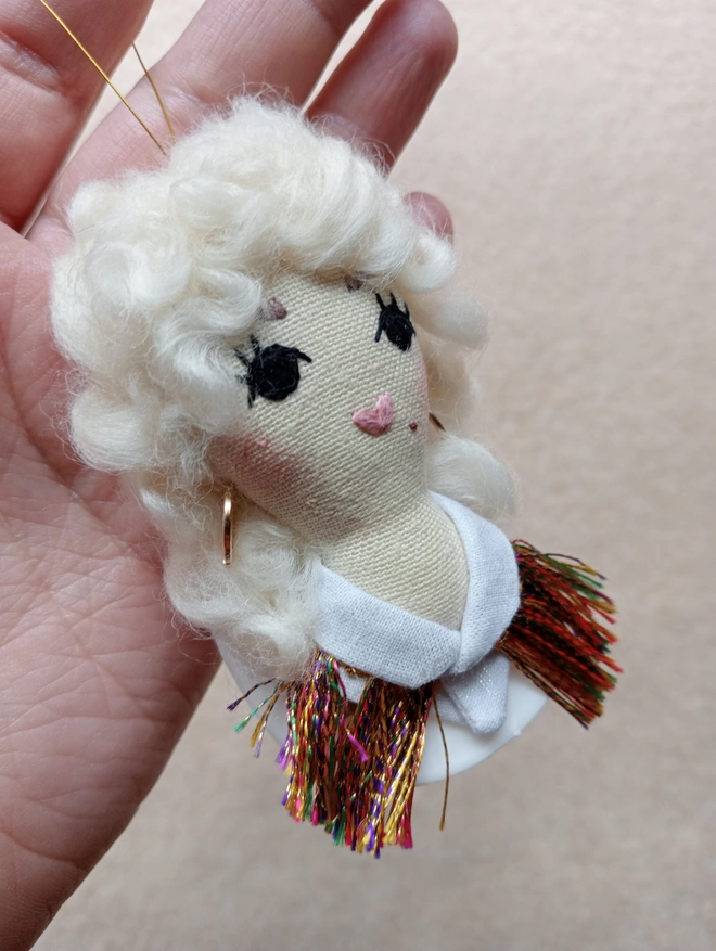 Dolly Parton hanging Christmas Tree decoration. Western style, all white outfit.
