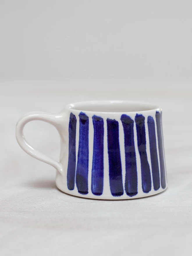 Gloss handmade mug with cobalt blue hand-painted stripes