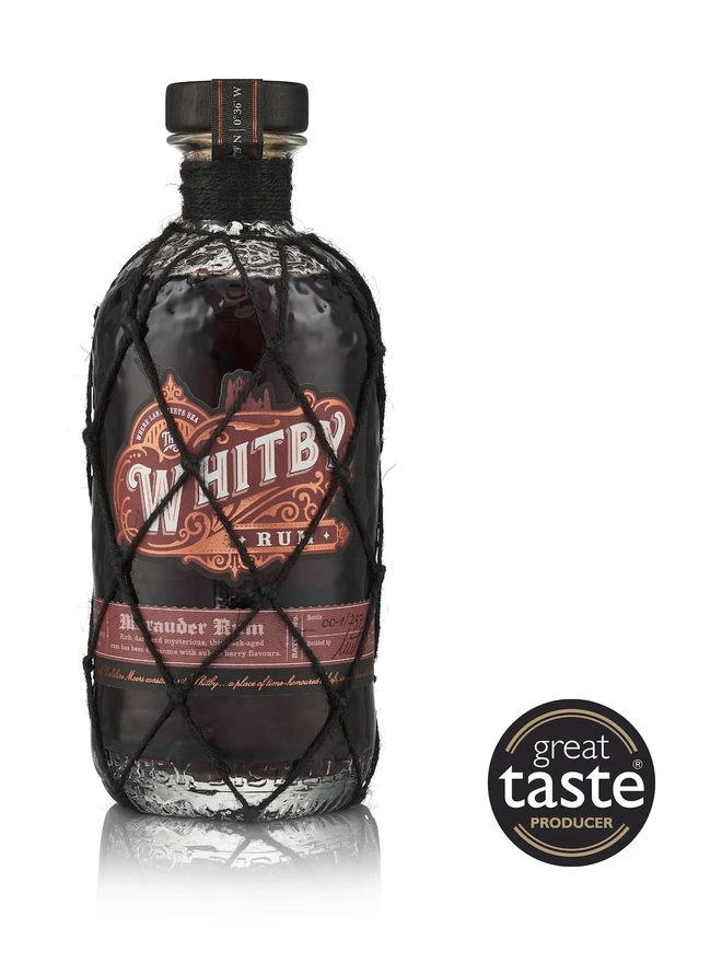 Whitby Marauder Rum: Gothic Dark Cherry Rum Edition, a bottle of rum sitting on a plain white surface. 