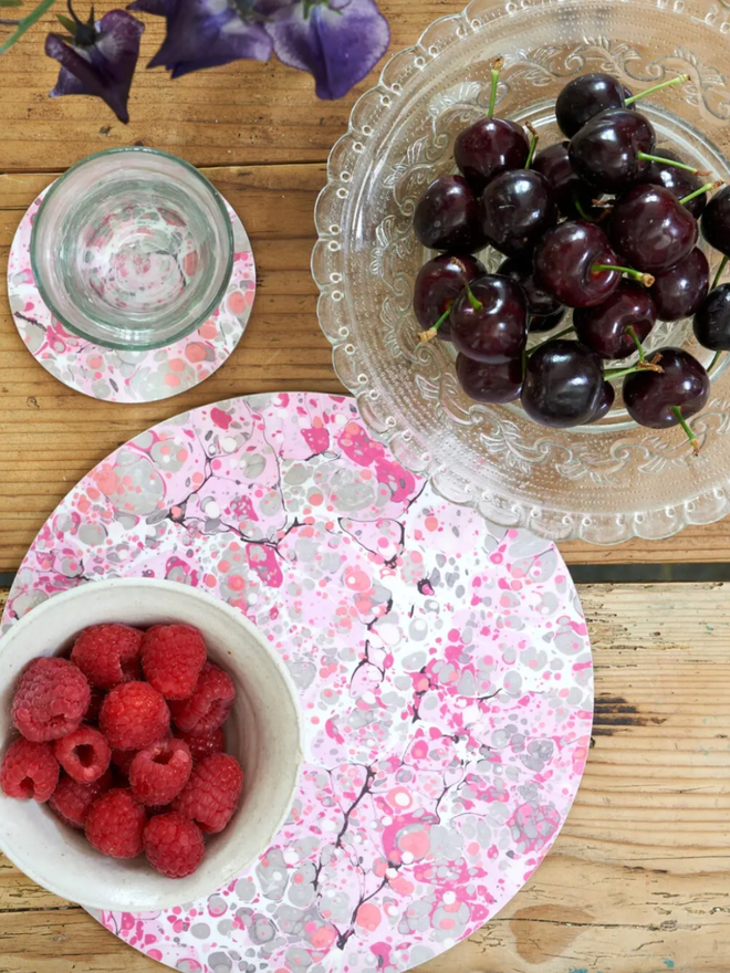 Round Table Mats. A pink round table mat.