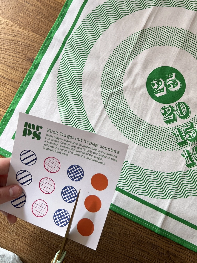 Cutting out the counters ready for playing the Mr.PS Target Napkin game