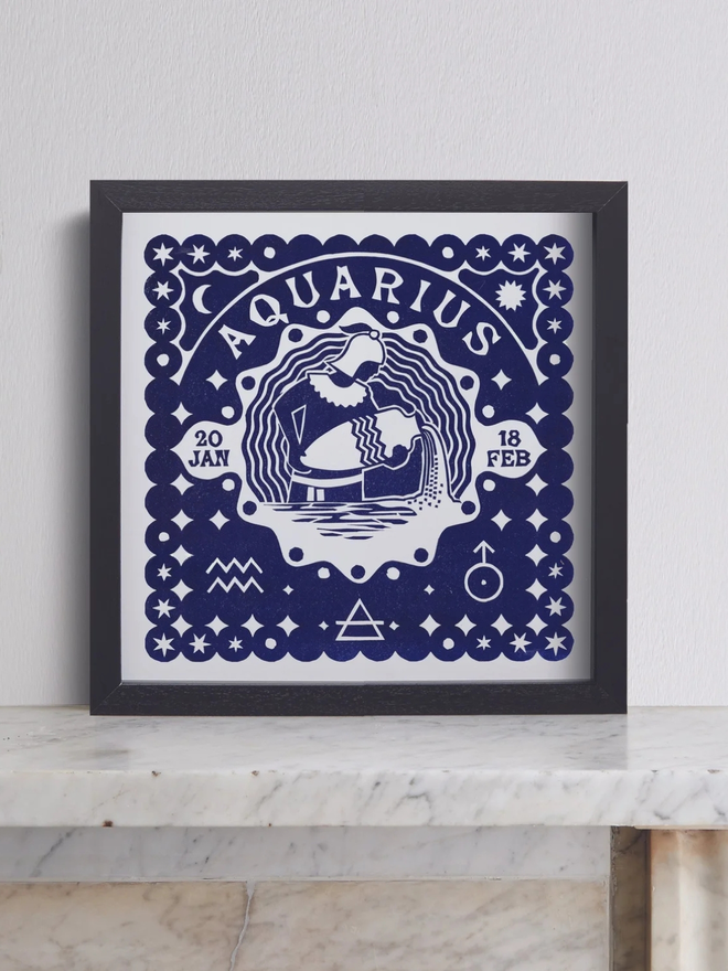 aquarius zodiac linocut. a linocut image of a man pouring water and zodiac symbols, printed on aa blue background.