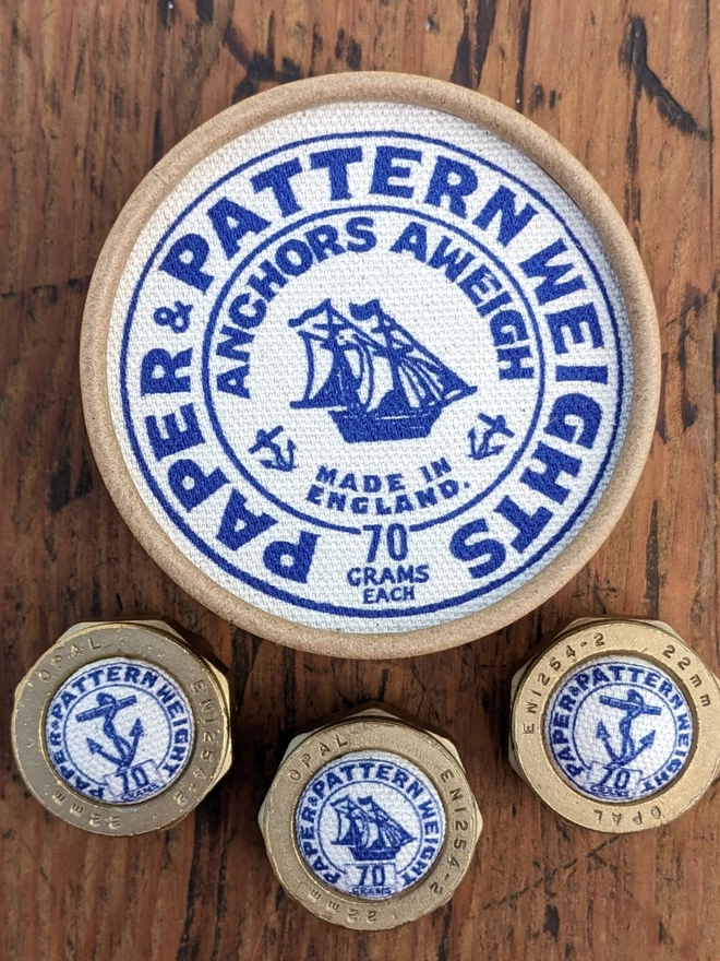 Set of 3 Royal Blue Anchors Aweigh Pattern Weights next to box