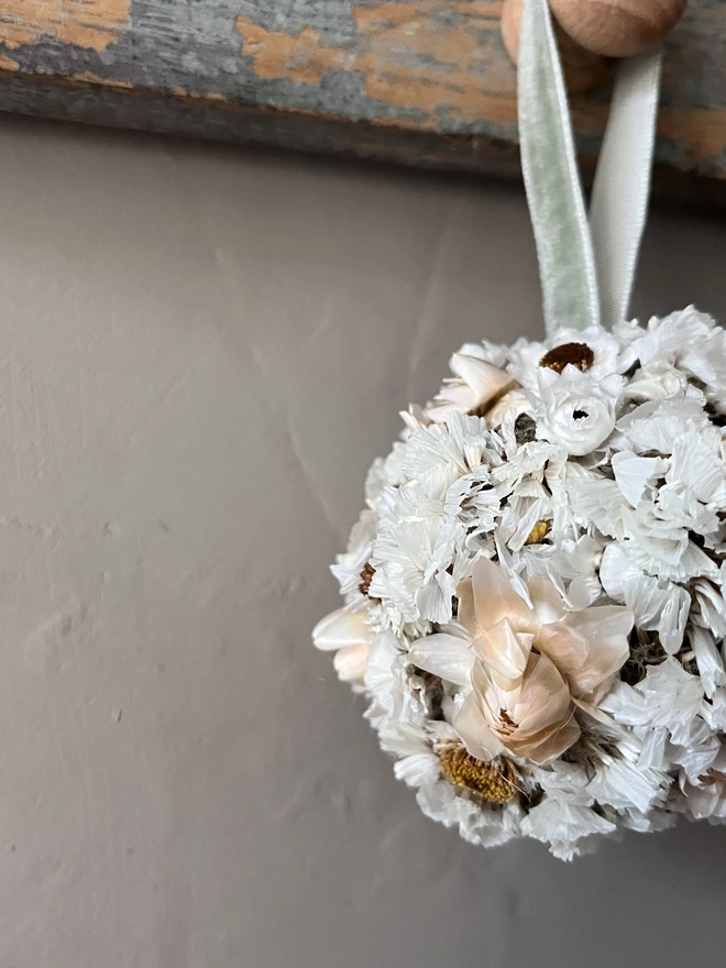 Snow Dried Flower Bauble. A dried flower bauble made of seasonal white flowers.