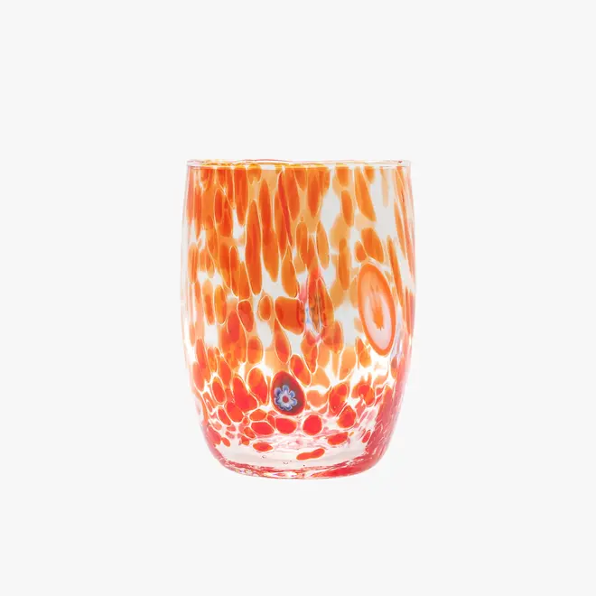 round tumbler glass with red splotches