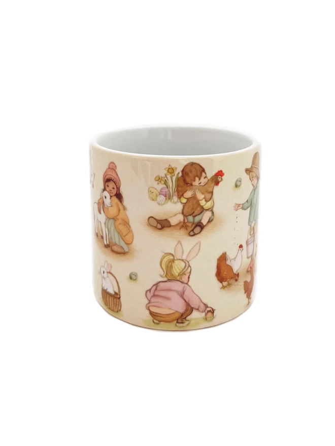 a childs easter mug illustrated in sweet drawings of children having their easter day 