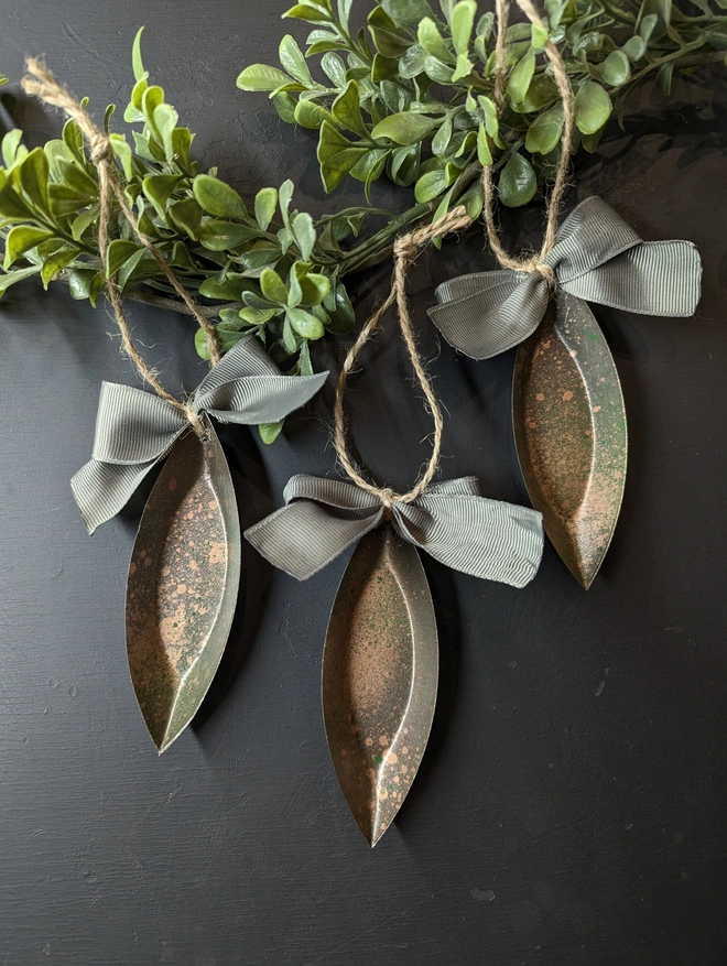 rustic handmade baubles, tin with painted patina and a ribbon