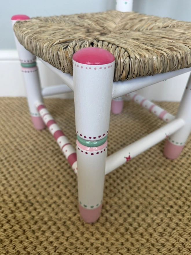 Handpainted detail on Childs wooden rush seat chair. 
