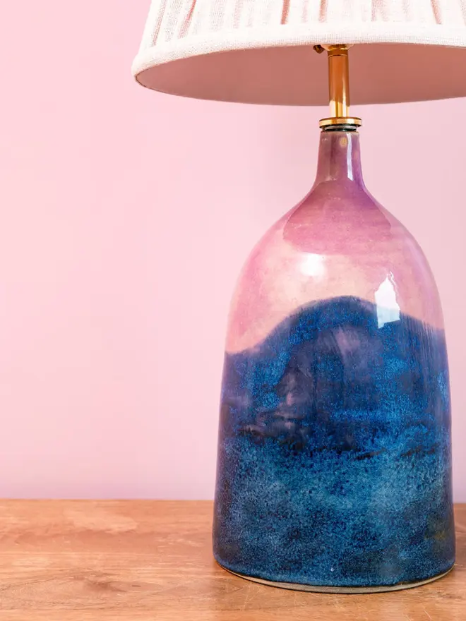 Bottle lamp with shades of blues and pinks