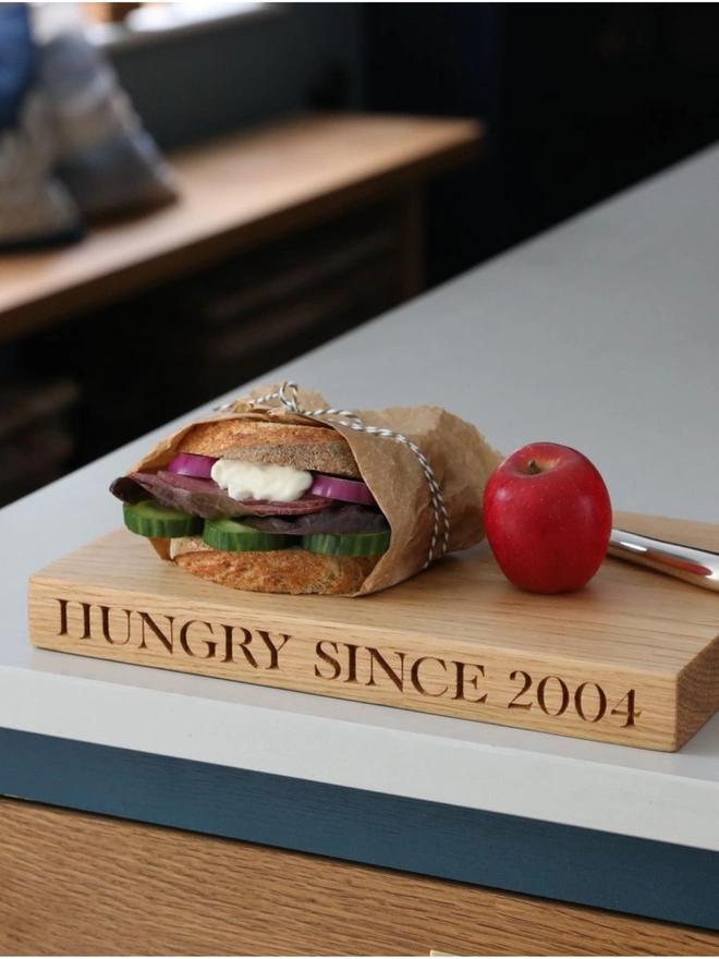 Hungry since engraved oak chopping board