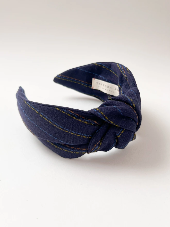 Knotted Headband with beautiful stitches running through it