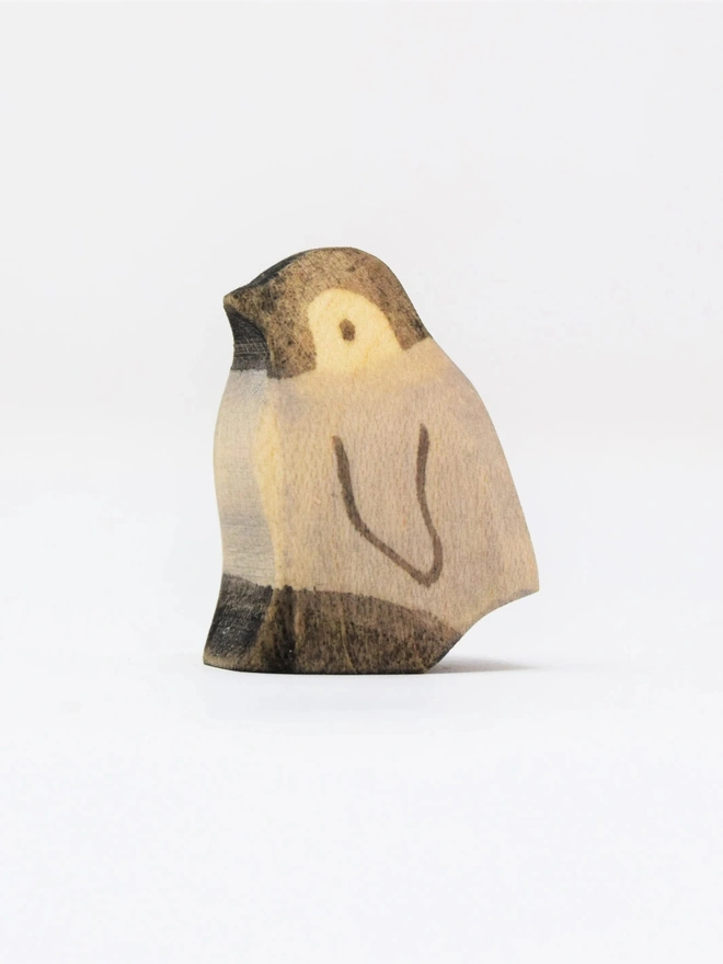 Wooden penguin with chick
