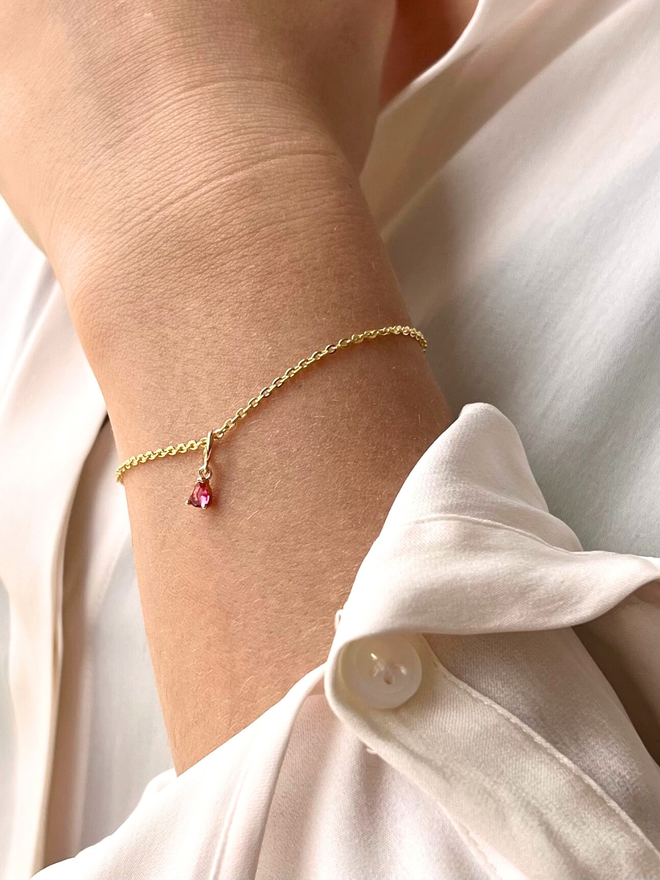 Solo pink birthstone bracelet on fine gold chain bracelet