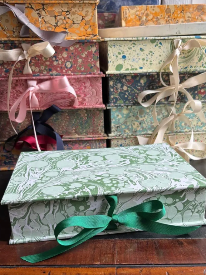 A5 Keepsake. A collection of keepsake boxes tied with bows.