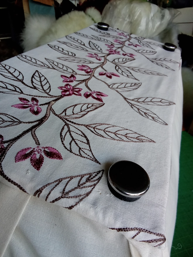 Underneath of the footstool showing the stainless steel glide feet.