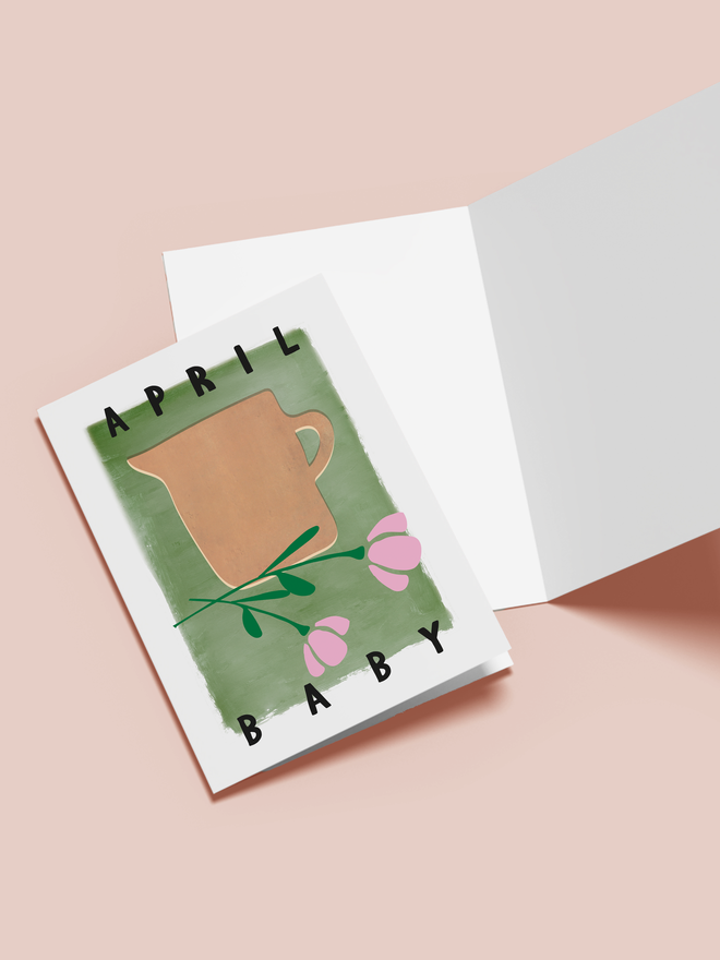 april baby illustrated card. a green card with an illustrated jug and flowers in the centre.