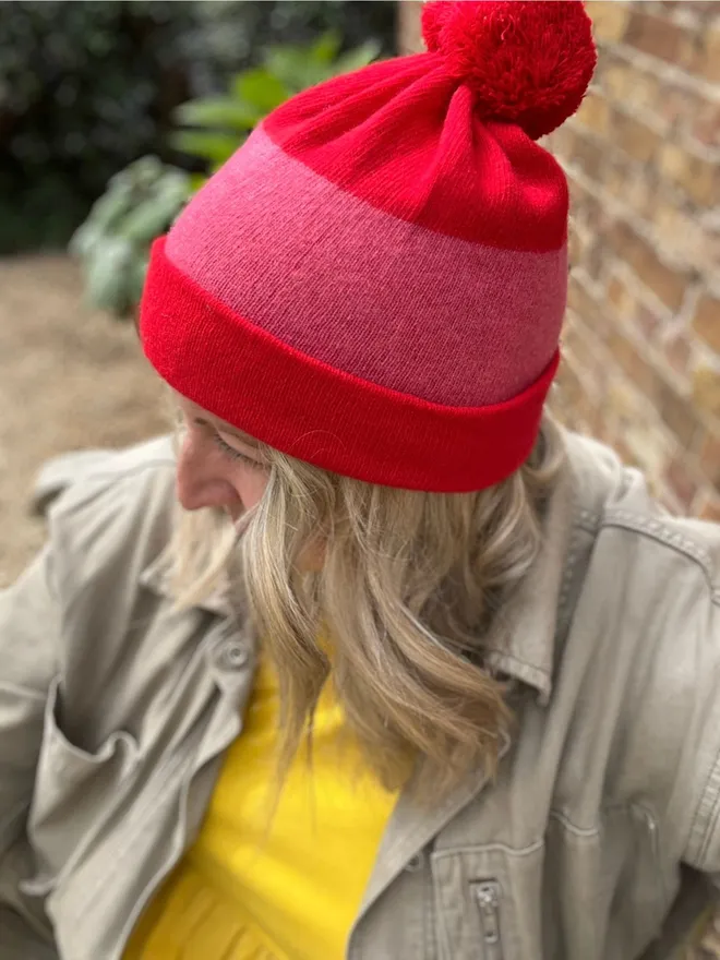 merino wool red pink beanie hat worn on model