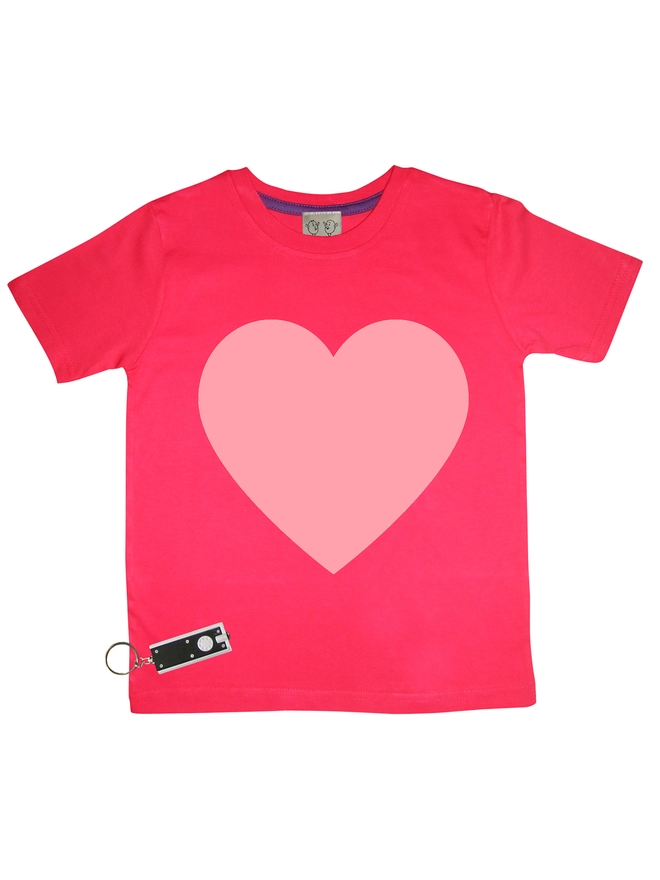 Red tshirt with a large pink heart printed on it. Shown with a small penlight