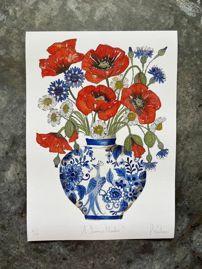 summer meadow flowers, red poppies, cornflowers and daisies in a delftware ceramic vase