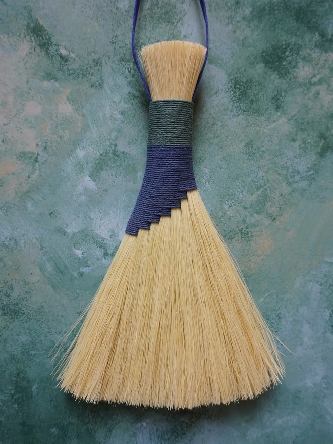 Handmade tampico brush with blue and teal hemp cord binding