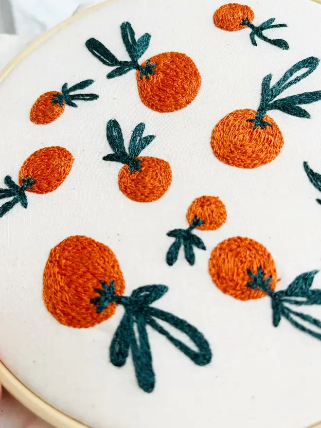 custom embroidered hoop. cotton hoop embroidered with small oranges.