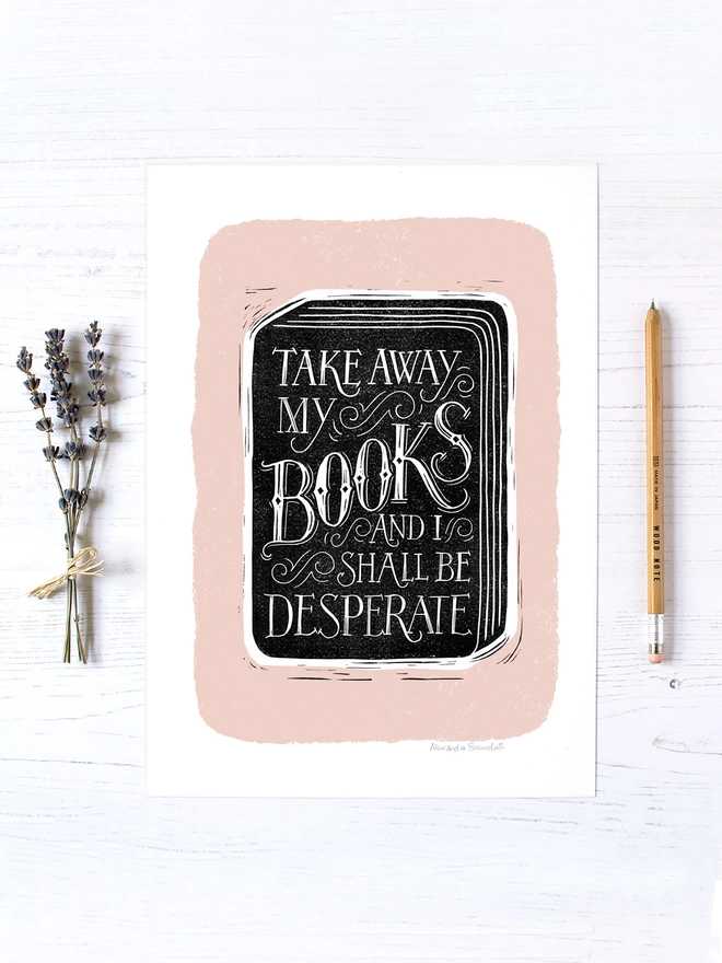 book reading quote print in black, white and pink shown unframed with lavender and wooden pencil