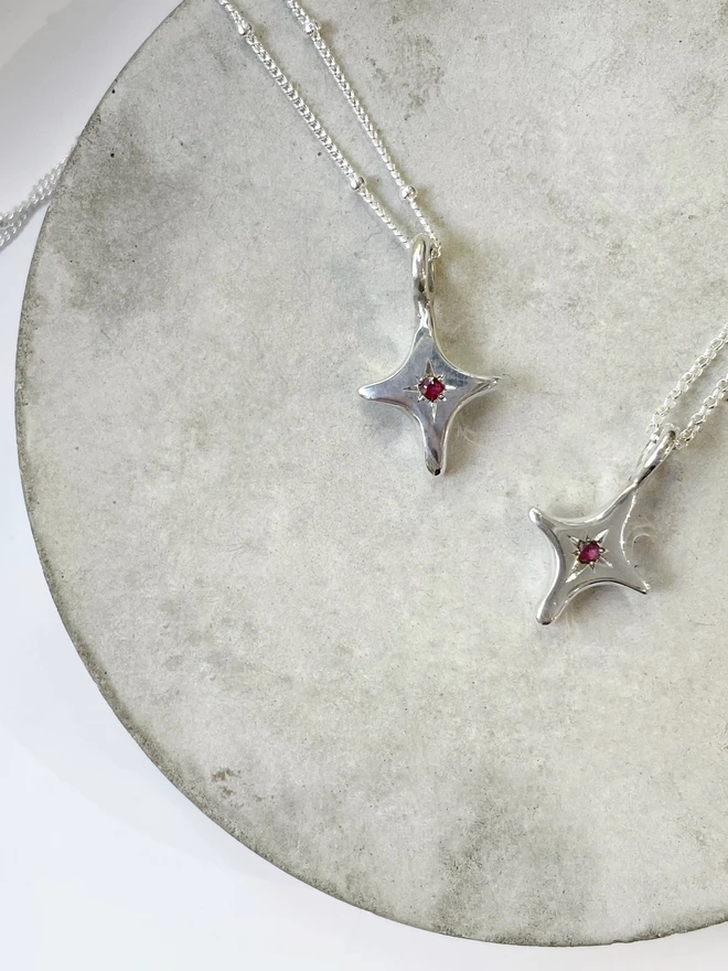 Handmade 'You're A Star' charm necklace made from 100% recycled sterling silver, set with a Ruby, the birthstone of July. A perfect gift for your friend, girlfriend or wife for their birthday or just to remind them how much you love them! Add a personalised initial and send straight to your special someone. Made by Celina C Jewellery, a small business in the UK, find on Holly and Co.