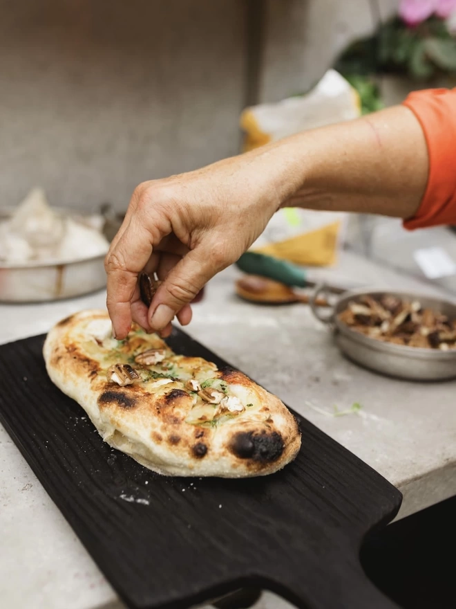 Large Charred Black Serving Board With Tasty Food