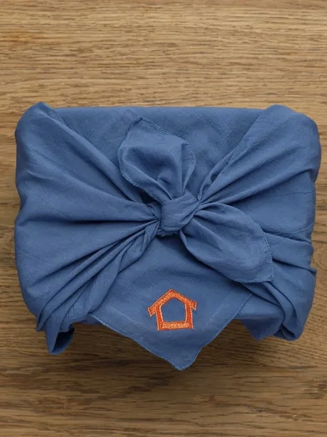 Omiyage Collection, a traditional japanese cloth sitting on a wooden surface. 